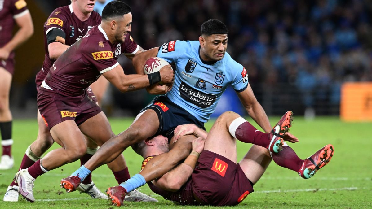 Daniel Tupou tackled during game three of the State of Origin Series last year in 2022