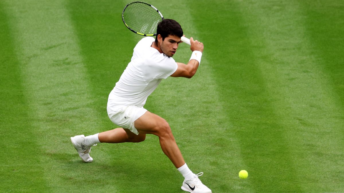 Carlos Alcaraz of Spain plays a backhand against Jeremy Chardy of France in the Men