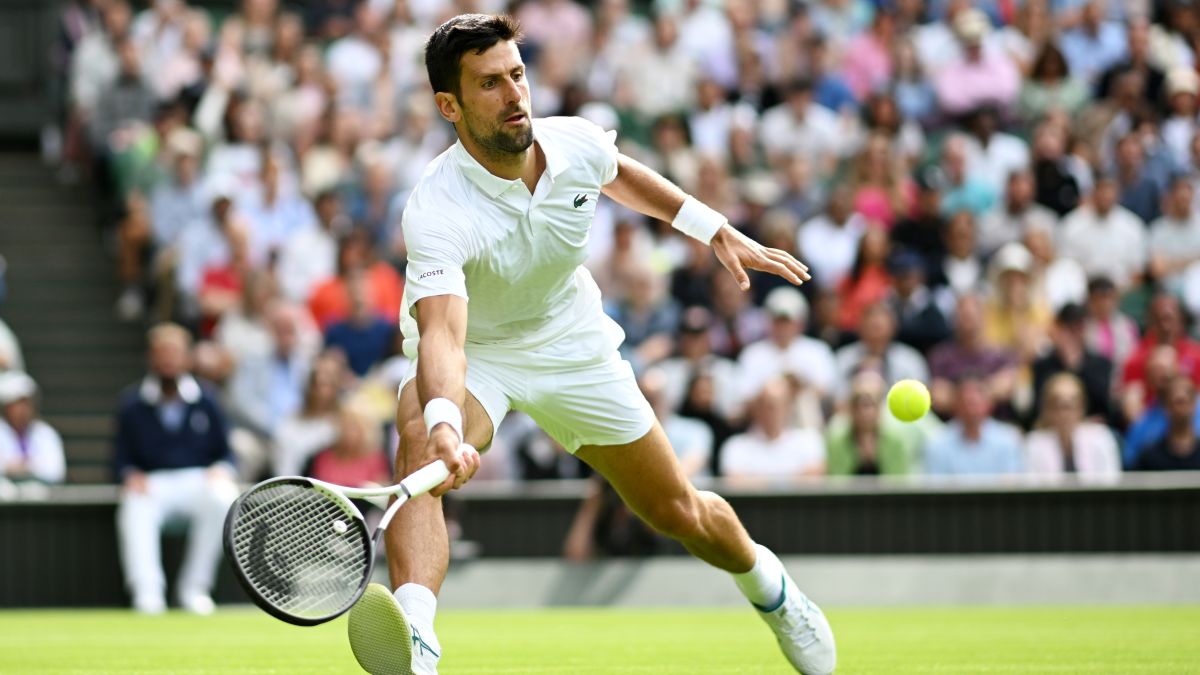 Novak Djokovic of Serbia stretches to play a forehand in the Men