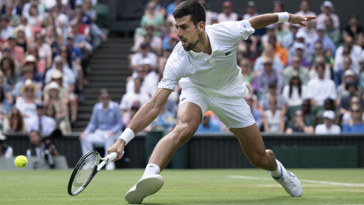 Novak Djokovic stretches for a backhand